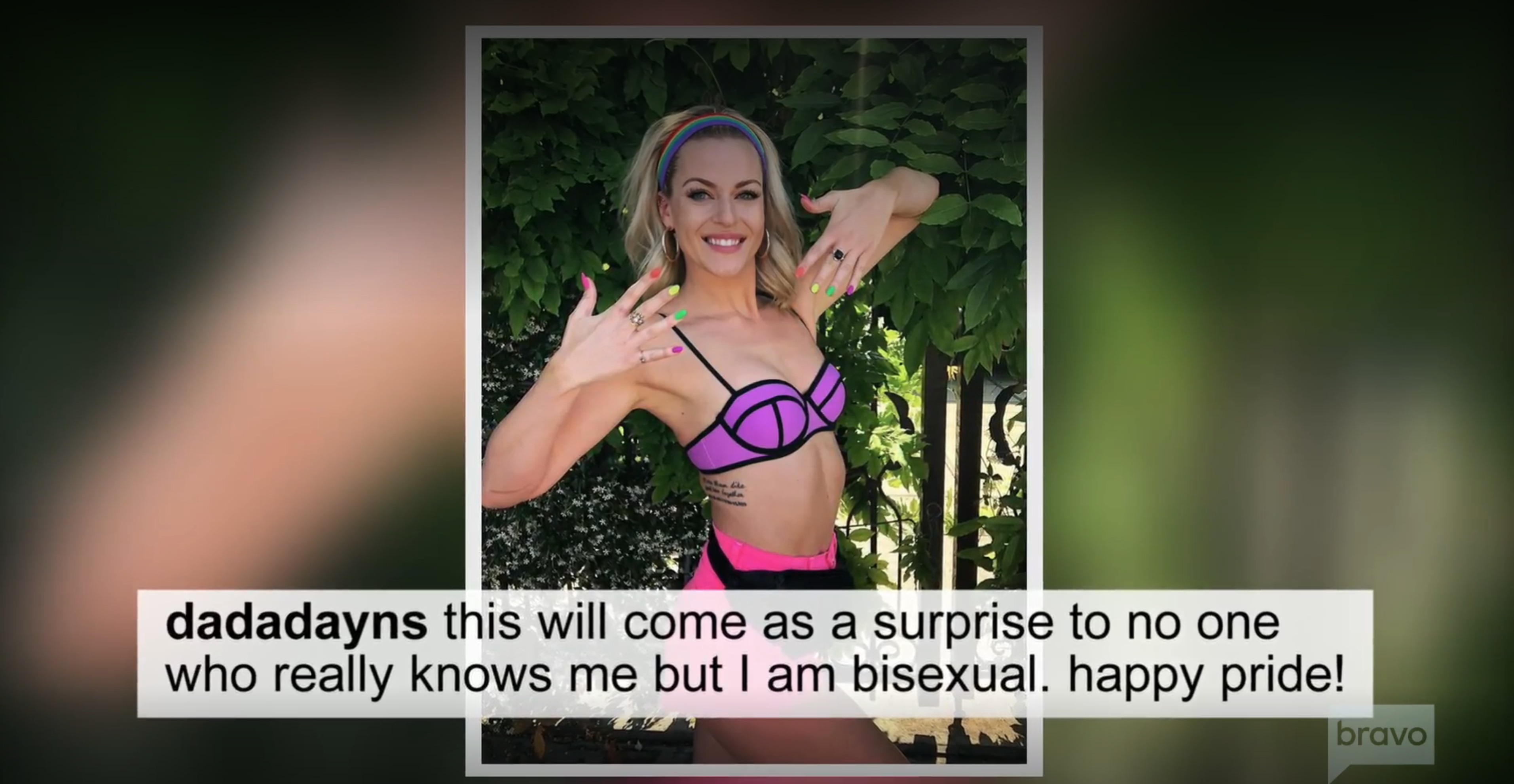 Dayna Kathan in a bikini top and shorts, raising her hands to show off her neon-colored nail polish, with text below her image that reads,