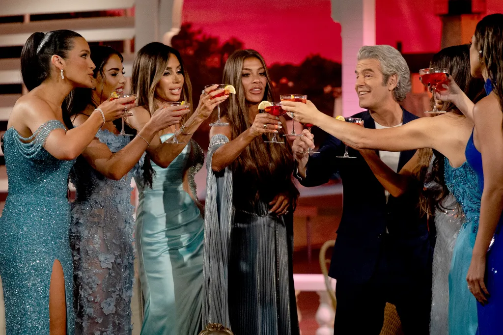 Ashley Iaconetti, Rosie DiMare, Rulla Nehme Pontarelli, Liz McGraw, and Andy Cohen toast during The Real Housewives of Rhode Island Season 1 reunion.