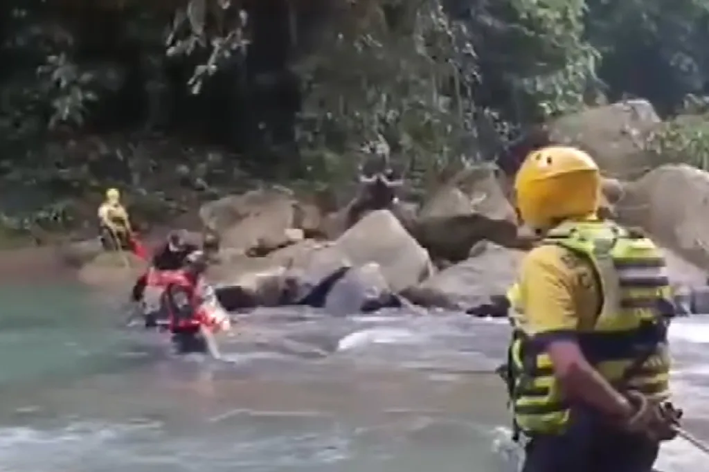 Rescue workers searching a Costa Rican river for a missing woman.