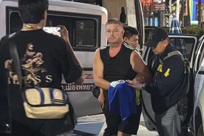 An Australian man being arrested at a Thai airport.