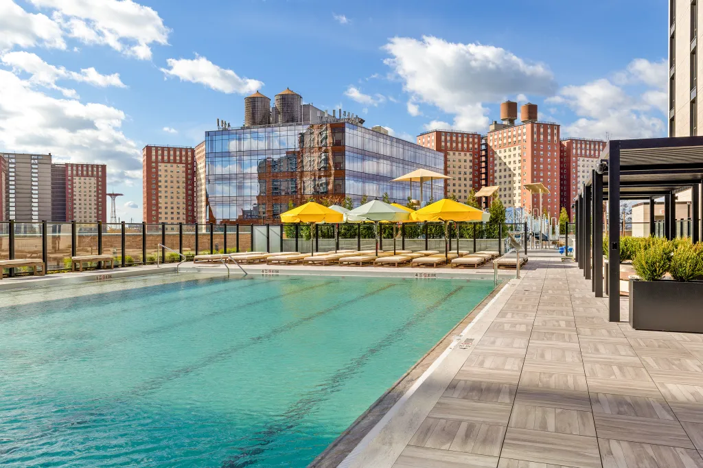 Sky Three Residences Club in Brighton Beach boasts Brooklyn’s largest residential rooftop pool at 2,600 square feet — a 70-by-40-foot saltwater oasis on the building’s fifth-floor wellness level with Atlantic Ocean views