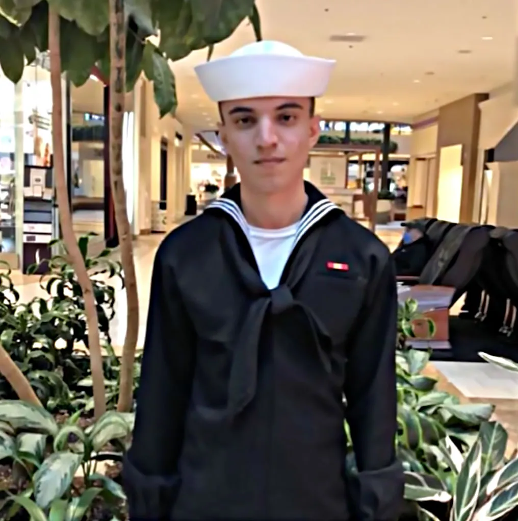 Bereen Dzayee in a Navy sailor uniform.