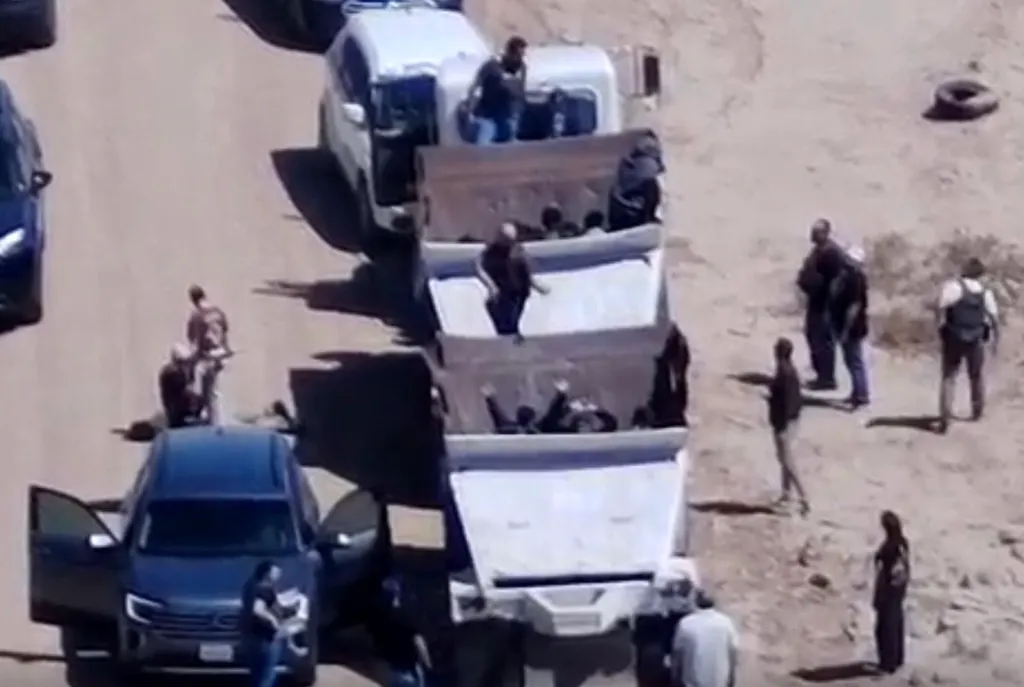 Border Patrol agents stop a dump truck concealing people and a Chevrolet Tahoe during a smuggling event.