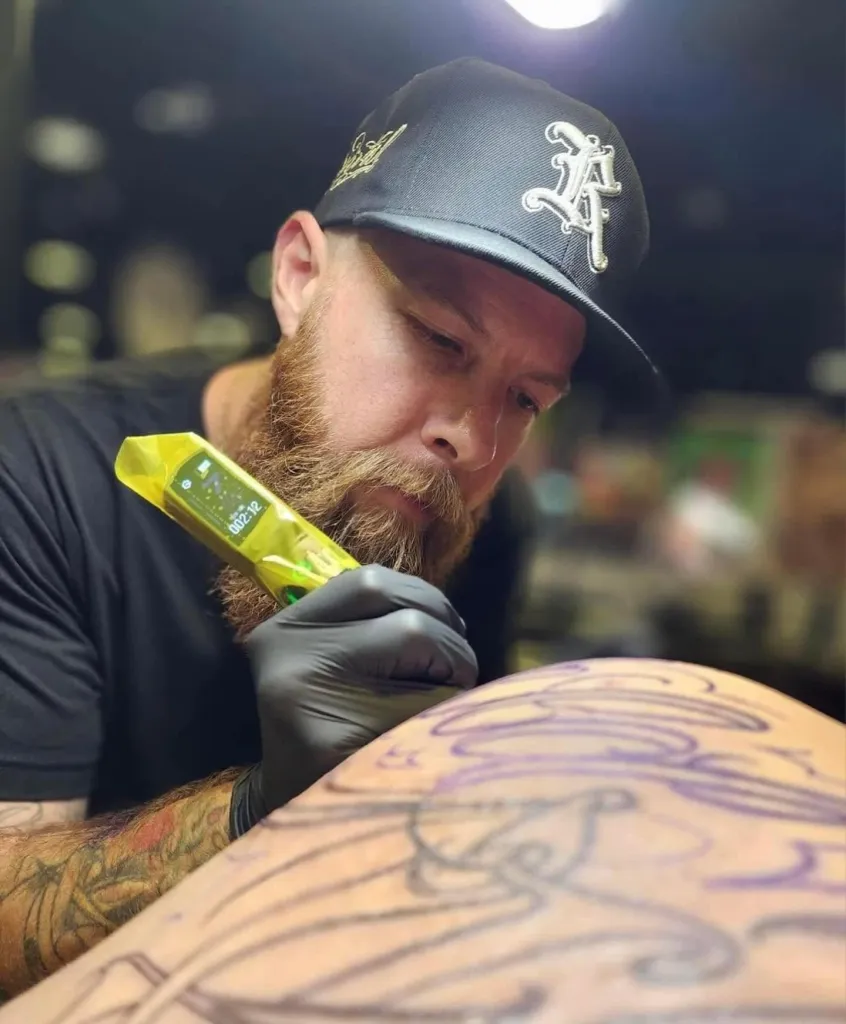 Revival Tattoo Collective founder Brady Martinson works on a customer at his tattoo shop in Largo, Florida.