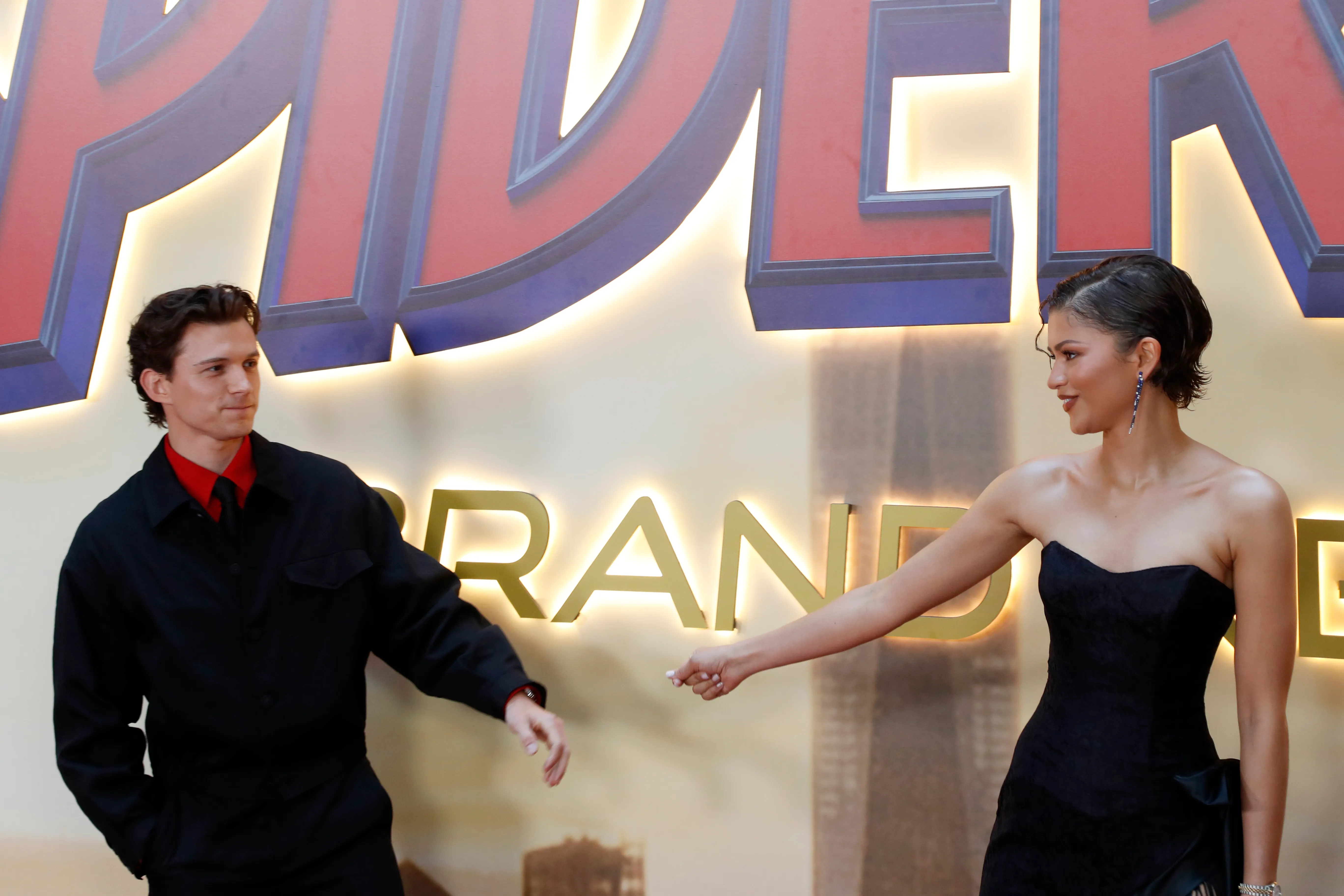 Tom Holland and Zendaya pose for a photo at the Spider-Man: Brand New Day premiere.
