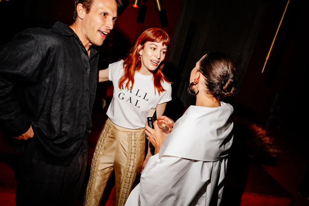 Britt Lower and Daniella Kallmeyer speaking with a man.