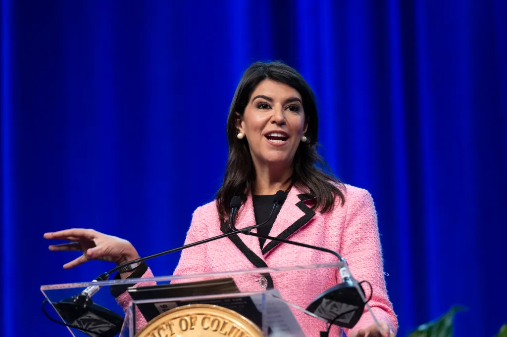 Brooke Pinto speaking at a podium while being sworn in for a second term as a council member for Ward 2.