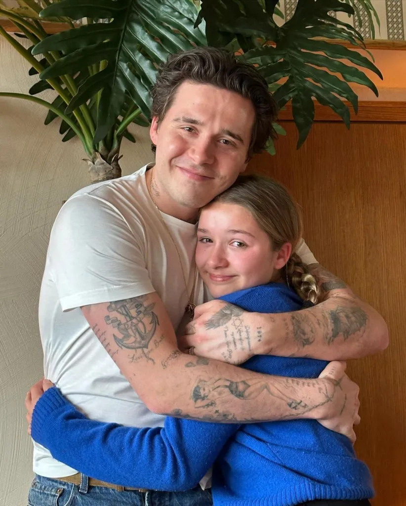 Brooklyn Beckham embracing his sister Harper.