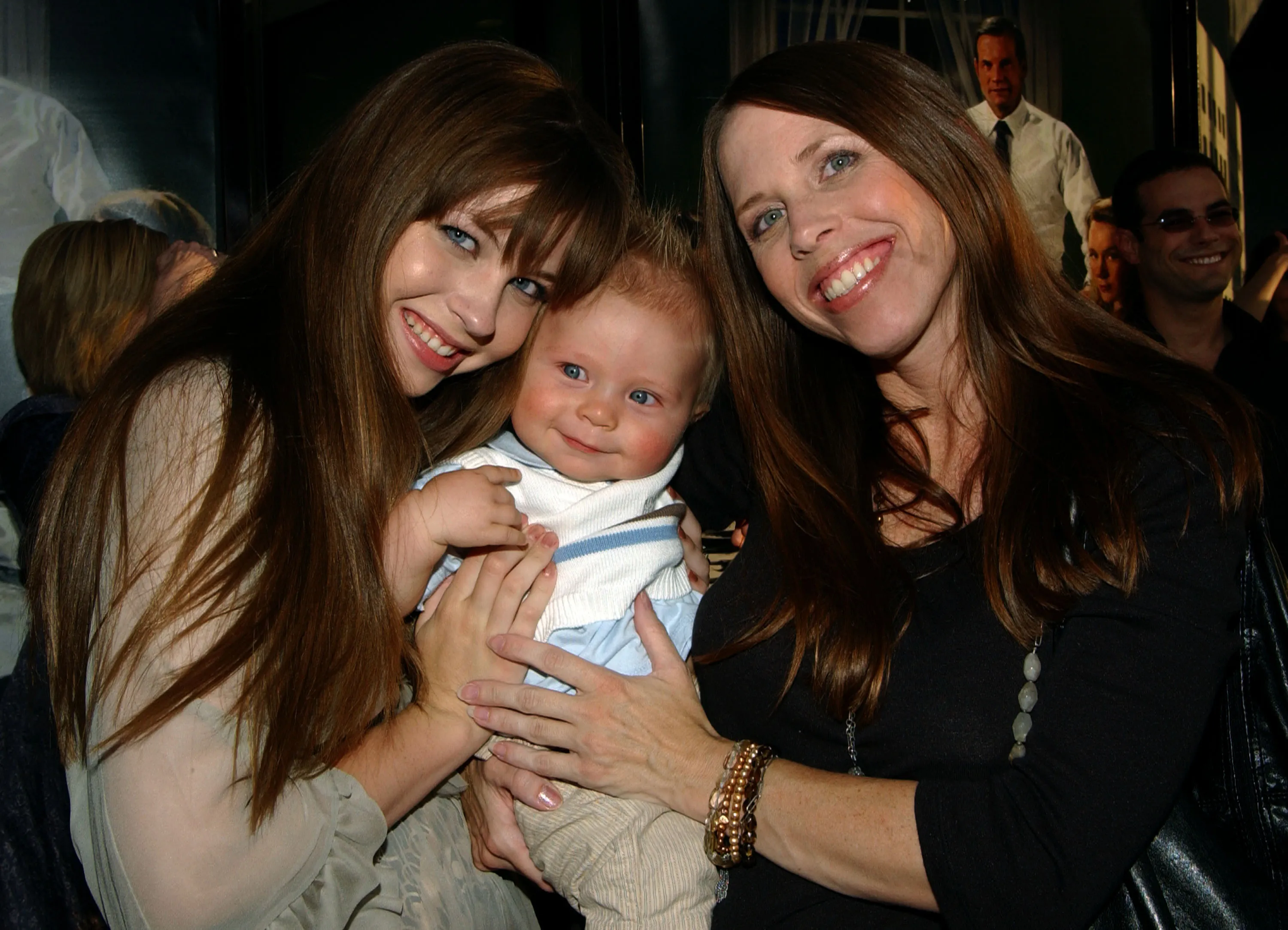 Daveigh Chase, her baby brother, and mother Cathy Chase at the 