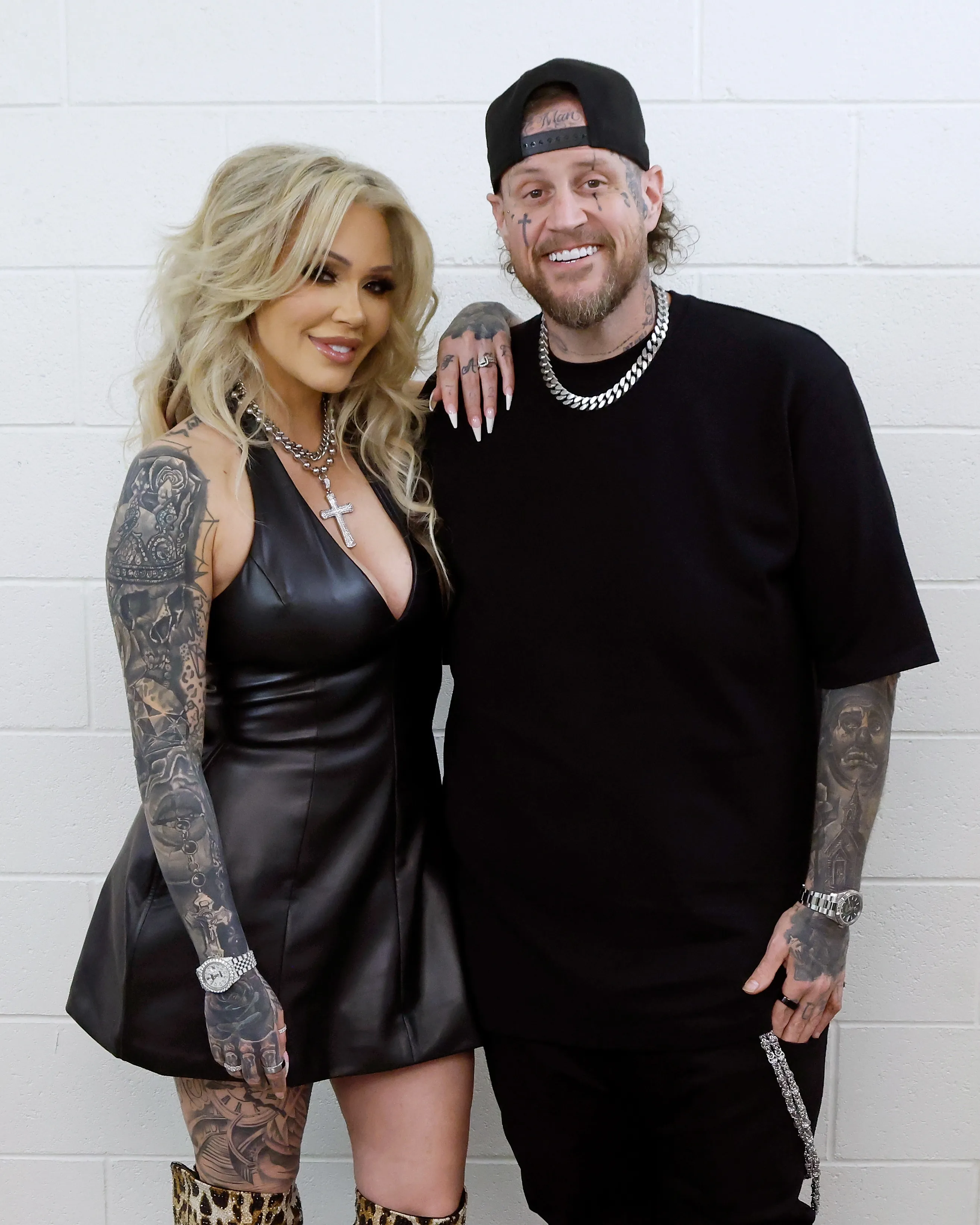 Bunnie XO and Jelly Roll posing together at a book tour event.