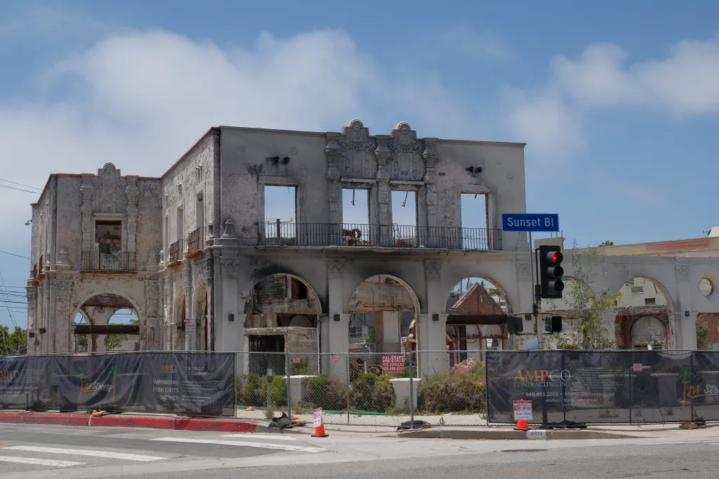 Exterior of a fire-damaged building in Pacific Palisades with 