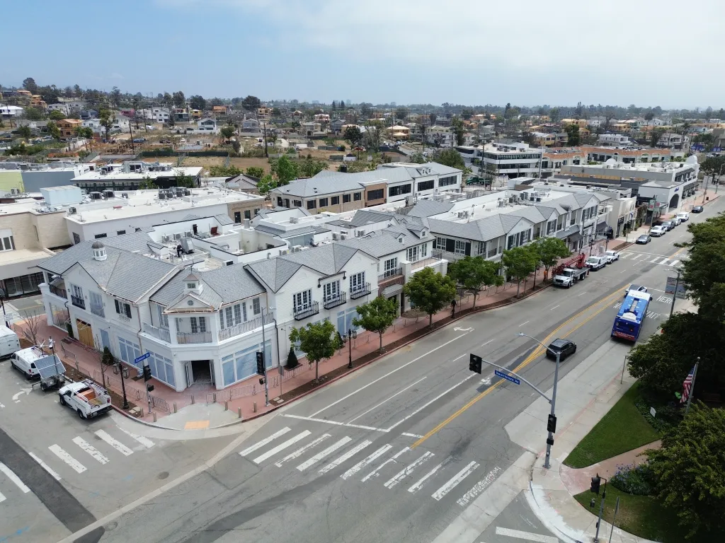 Aerial view of businesses reopening in Palisades Village following wildfires.