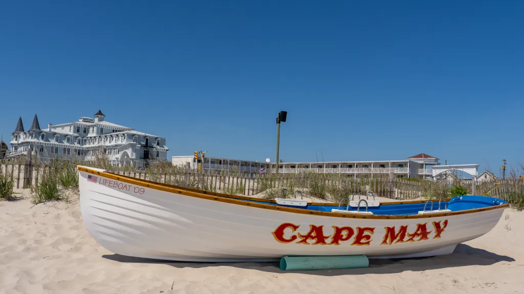 A white rowboat that says Cape May