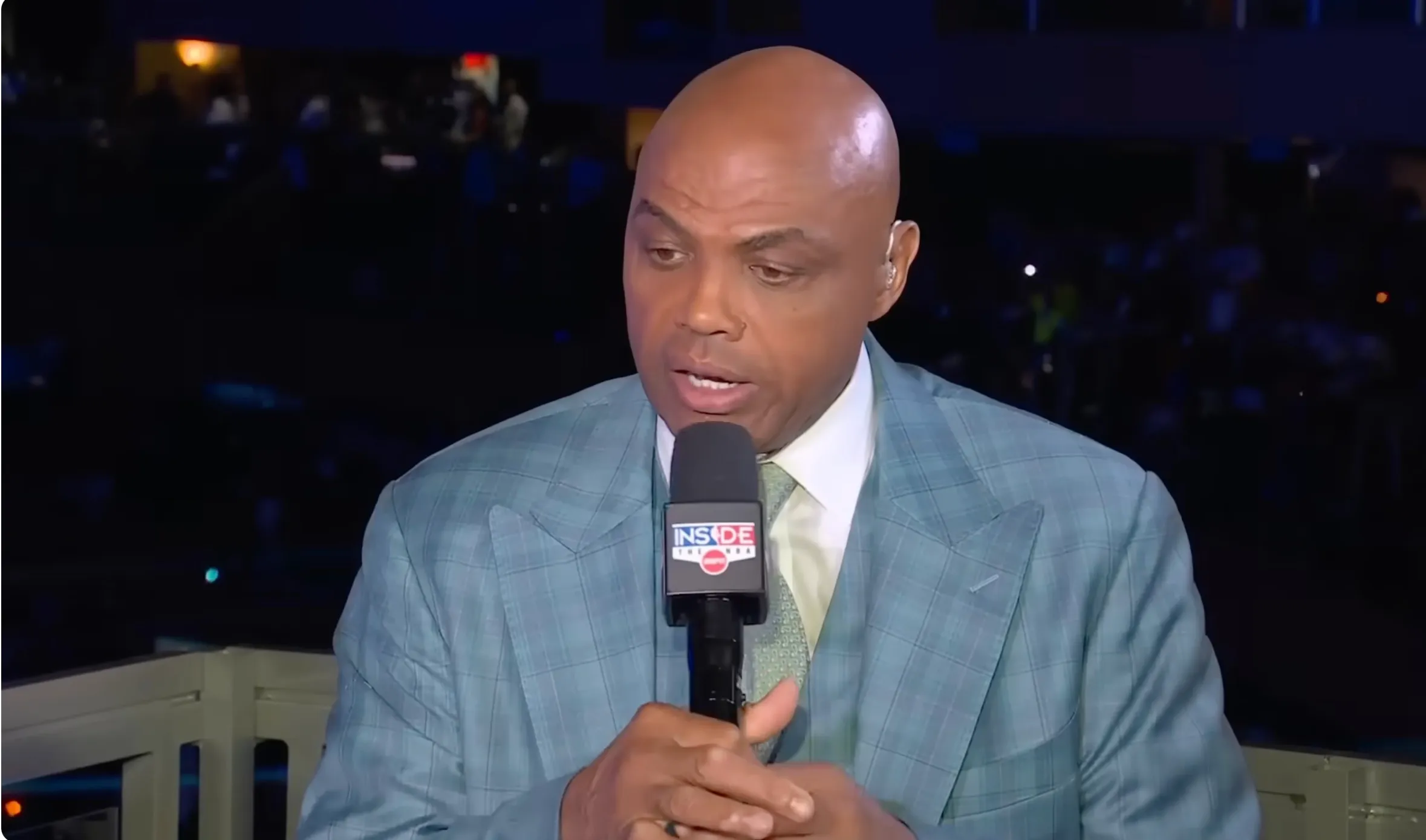 Charles Barkley speaking into a microphone.