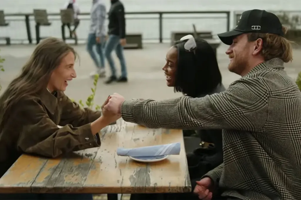 Amanda Batula, Ciara Miller, and West Wilson laughing at a table.