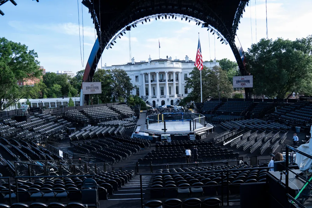 UFC Claw media preview at the White House, featuring an octagon ring surrounded by empty stadium seating.