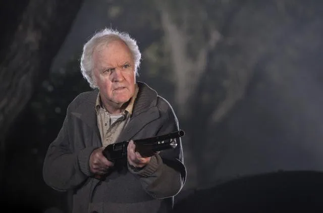 James Handy as a former bounty hunter, holding a shotgun.