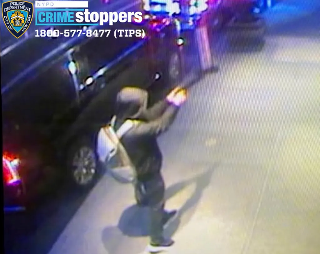 A security camera image of a suspect sought in the killing of UnitedHealthcare CEO Brian Thompson.
