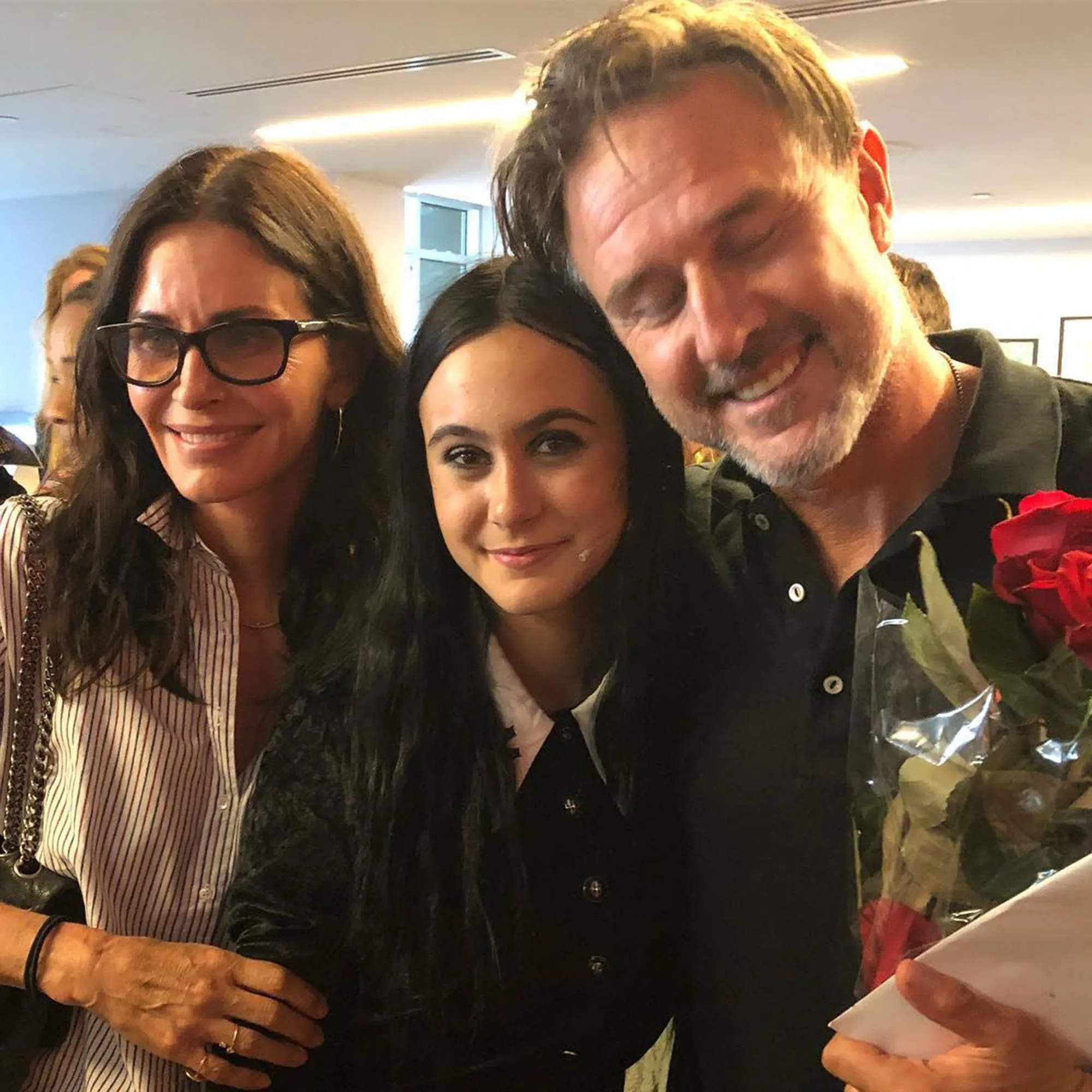 Courteney Cox, Coco Arquette, and David Arquette smiling at the camera.