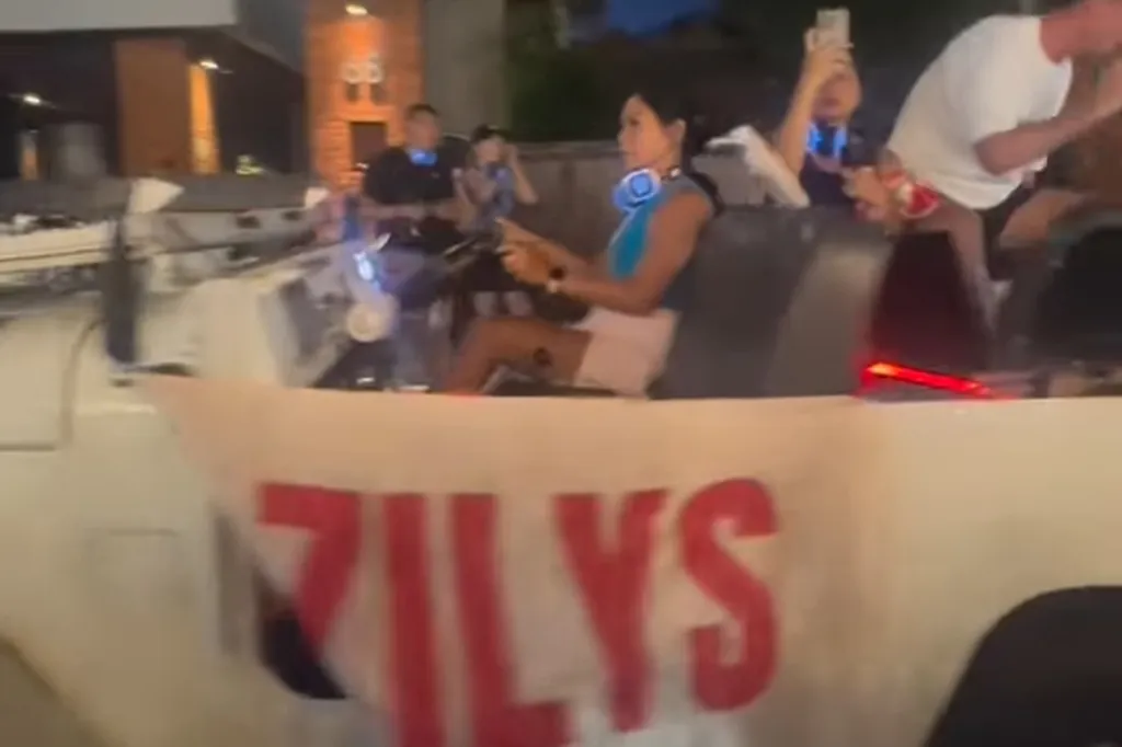 A woman driving a vehicle with a