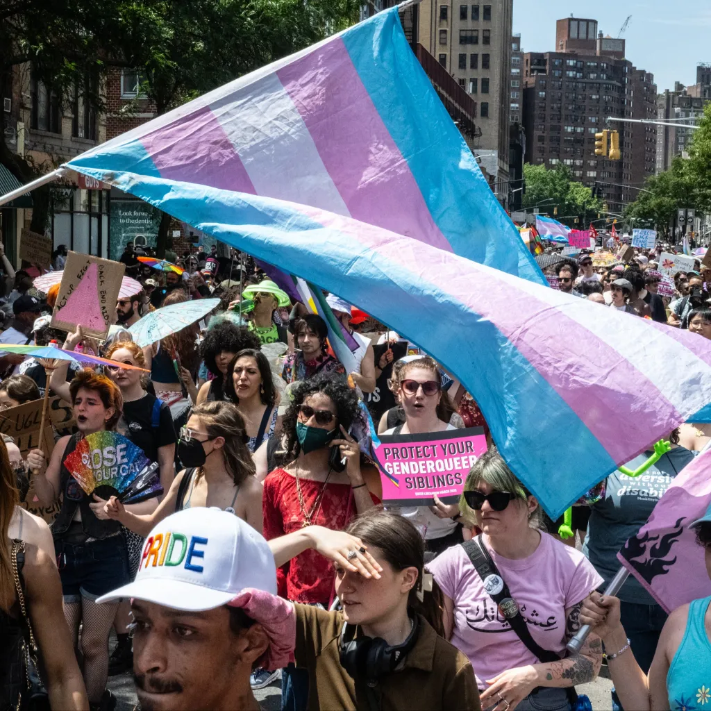 People fly a transgender flag as they participate in the annual Queer Liberation March on June 29, 2025 in New York City.