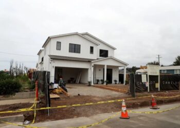 The new sound in Pacific Palisades: Hammers on nails