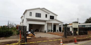 The new sound in Pacific Palisades: Hammers on nails