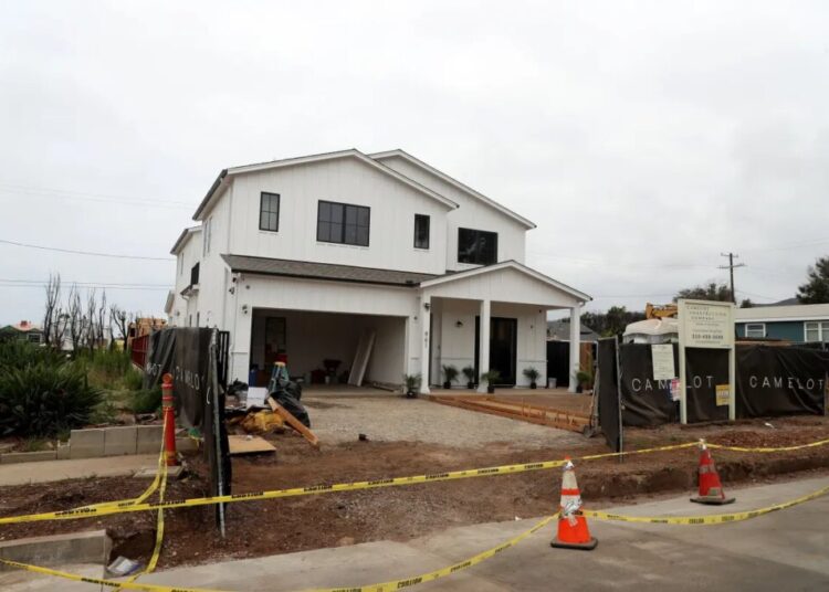 The new sound in Pacific Palisades: Hammers on nails
