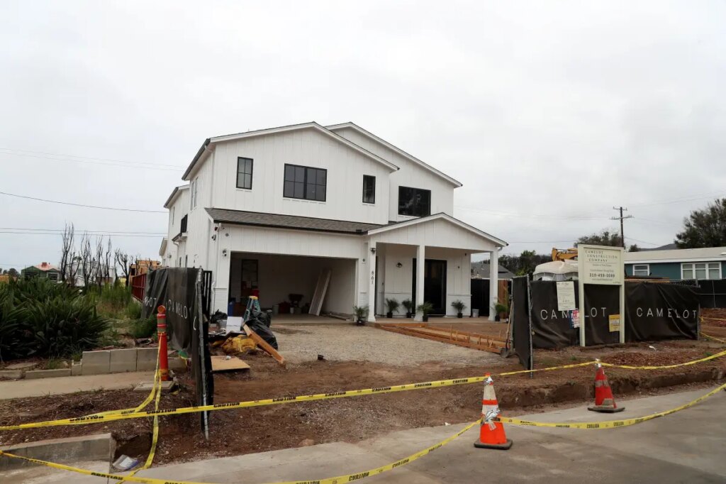 The new sound in Pacific Palisades: Hammers on nails