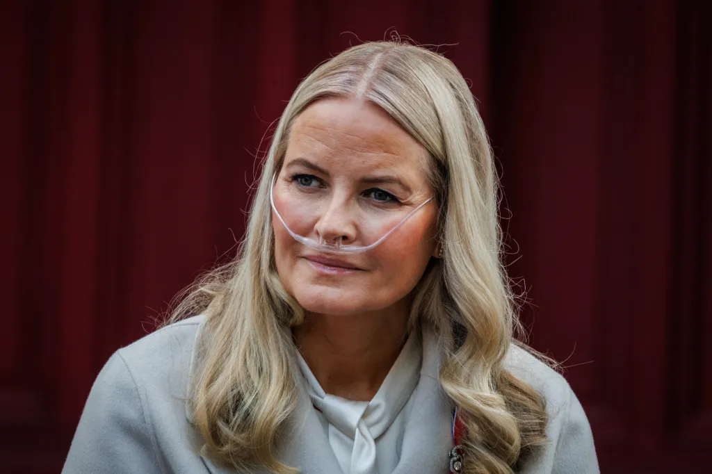 Crown Princess Mette-Marit of Norway wearing a nasal cannula.