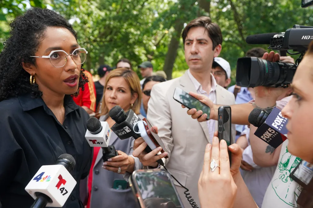 Darializa Avila Chevalier, a candidate for Congress, speaks to a New York Post reporter at Marcus Garvey Park.