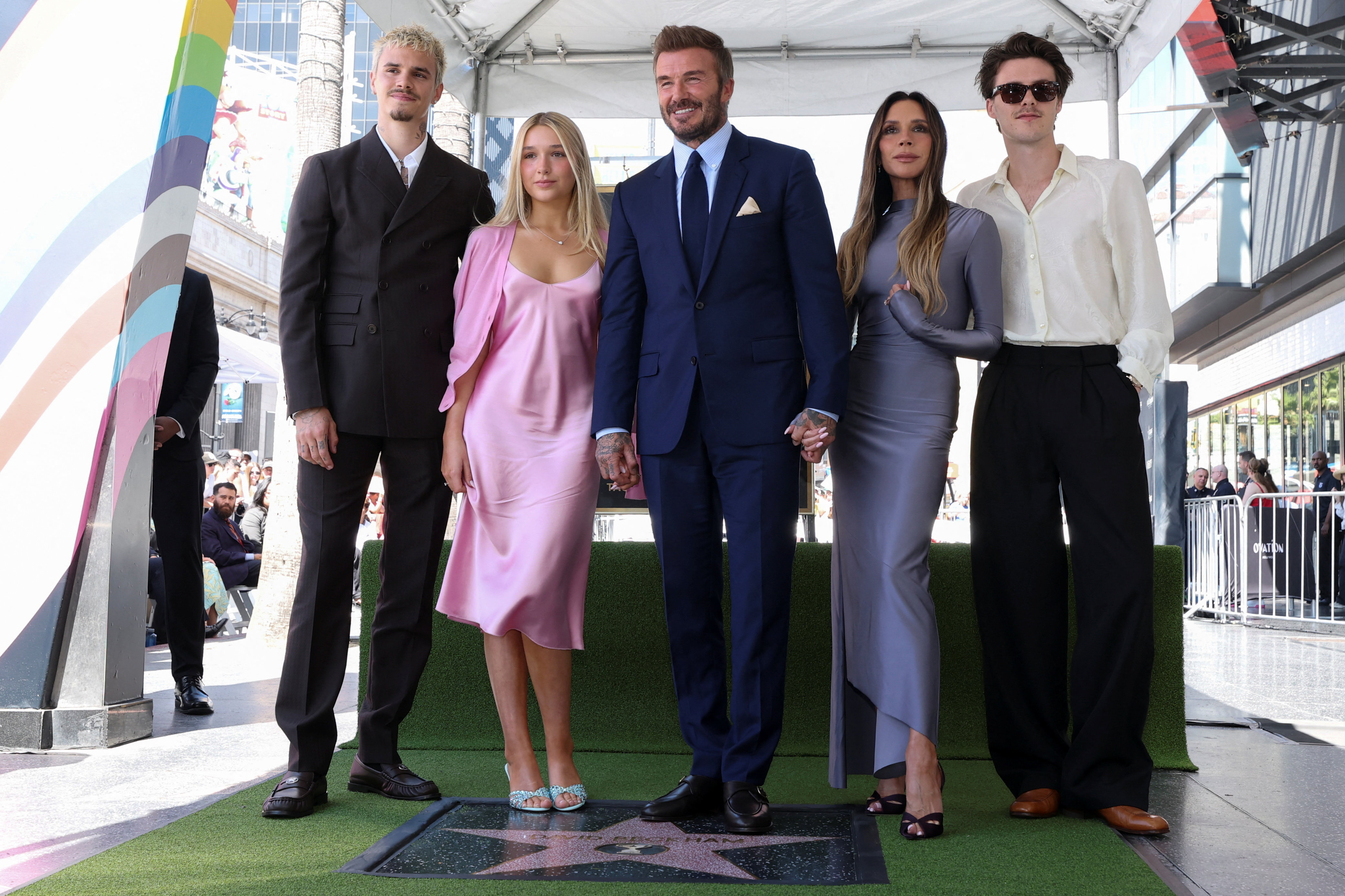 David Beckham poses with his wife Victoria Beckham, his daughter Harper Beckham and sons Cruz Beckham, Romeo Beckham and Brooklyn Beckham during his star unveiling ceremony on the Hollywood Walk of Fame.