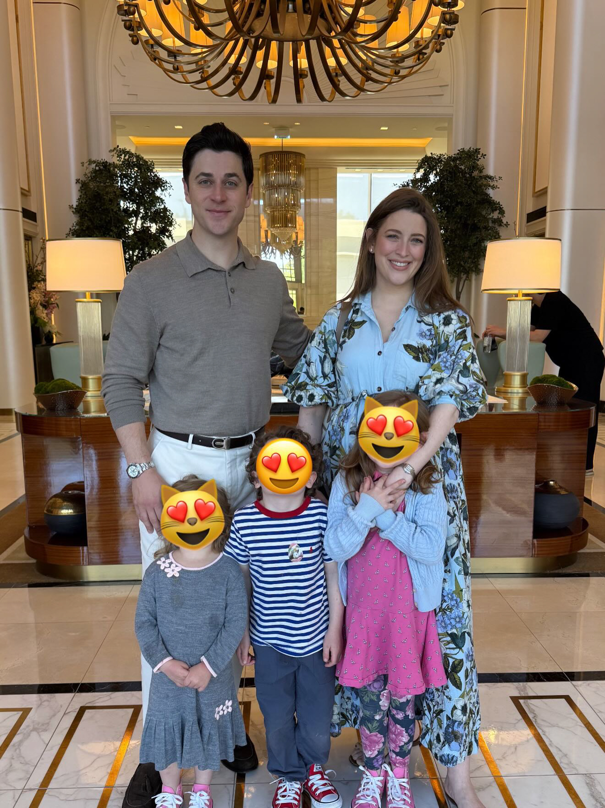 David Henrie and wife Maria, pregnant, with their two children, whose faces are obscured by cat-with-heart-eyes emojis.