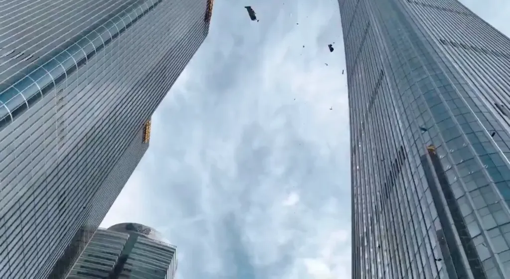 Debris falls after a small plane crashed into the CITIC Tower in Beijing, China, on June 26, 2026.