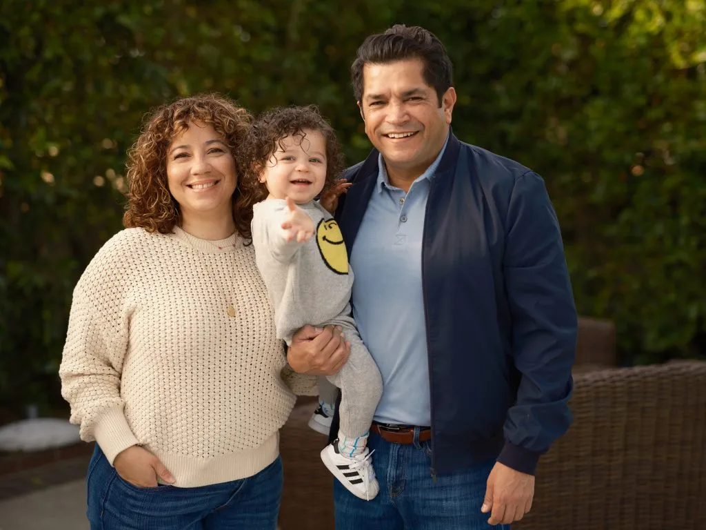Jimmy Gomez with his wife Mary Hodge and their child.