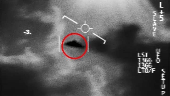 A declassified image shows a UFO in flight against the sky. 