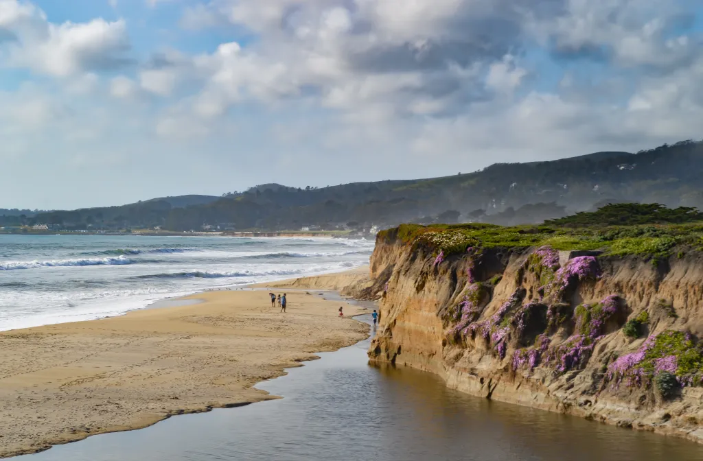 A family explores the estuaries, reefs, and beach in Half Moon Bay, California.