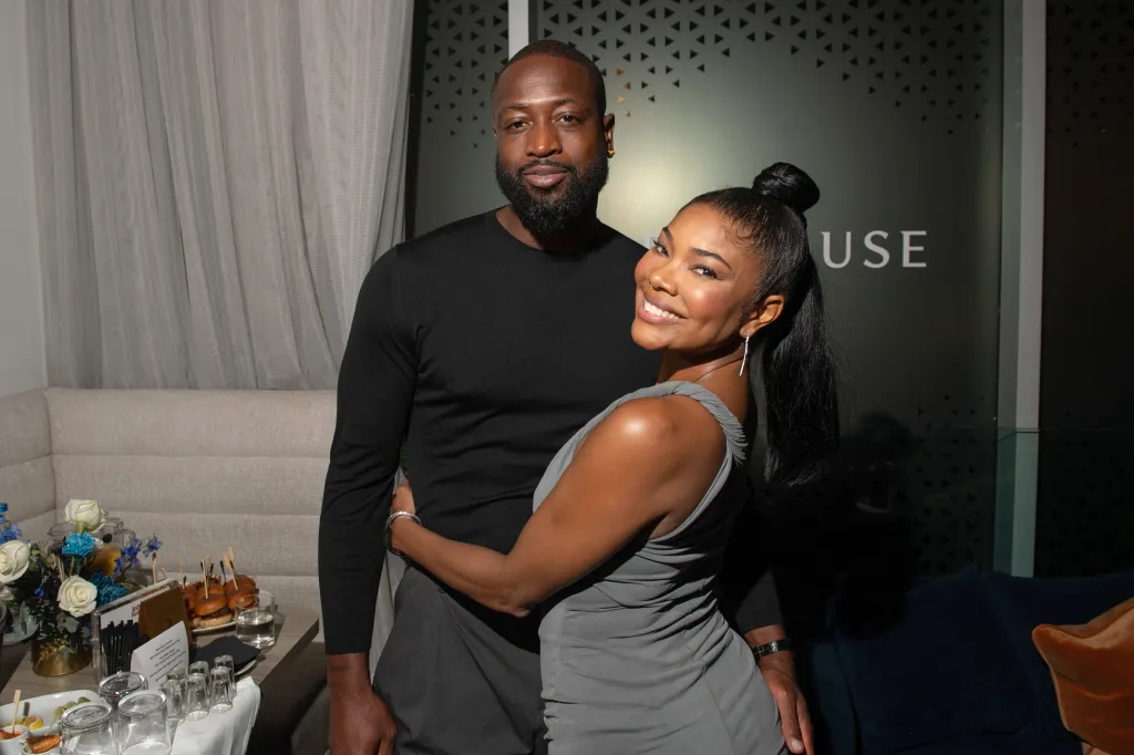 Dwyane Wade and Gabrielle Union pose for a photo at the 