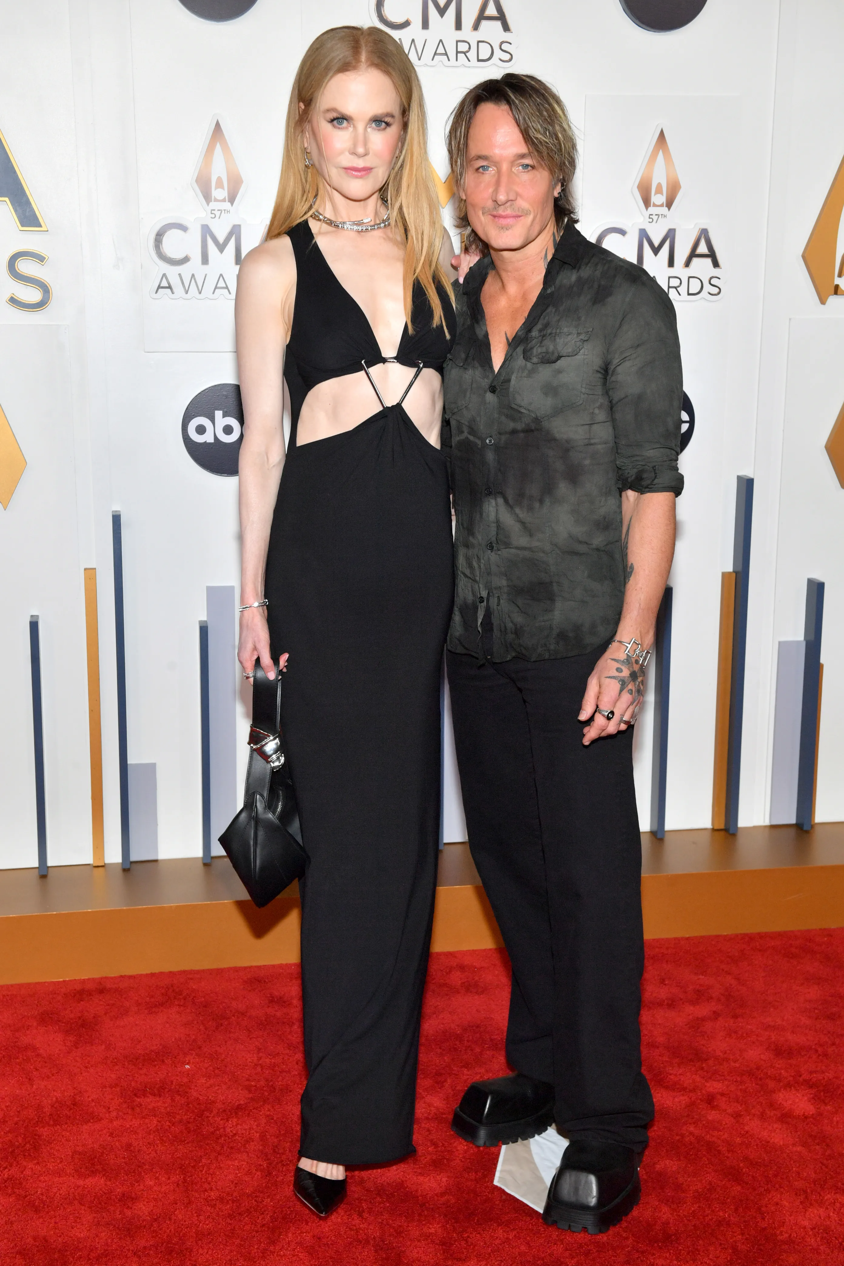 Nicole Kidman and Keith Urban pose on the red carpet at the 57th Annual CMA Awards.