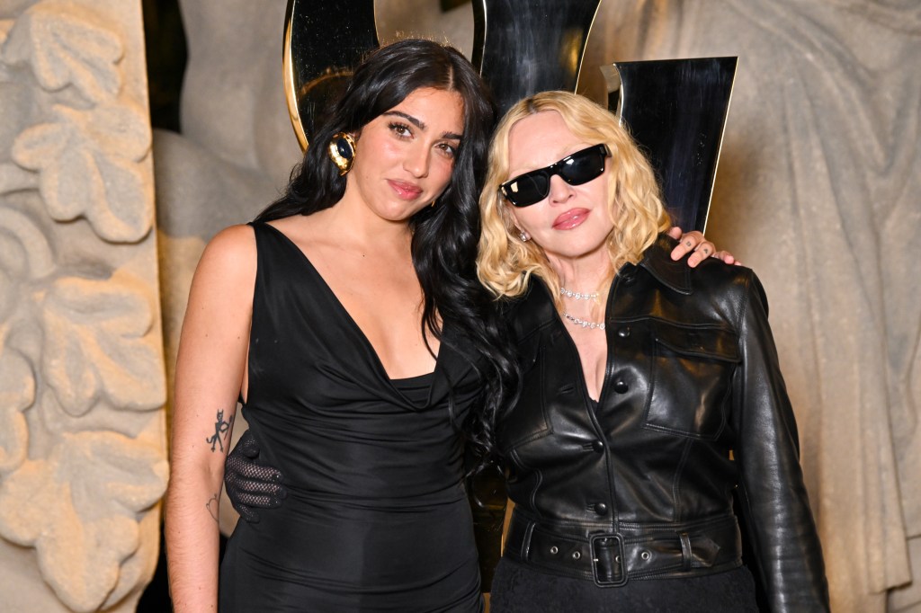 Lourdes Leon in a black dress and Madonna in a black leather jacket and sunglasses.
