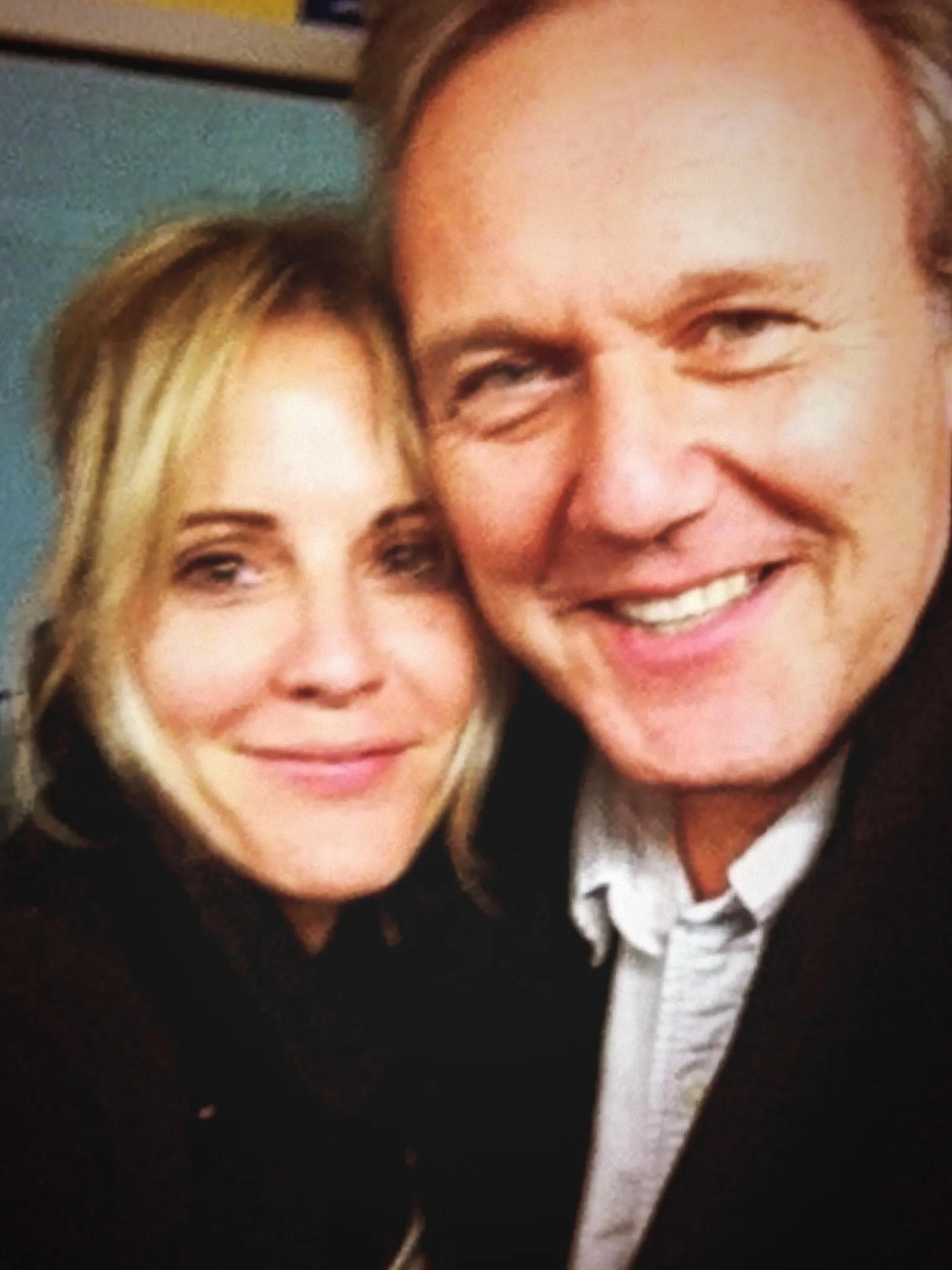 Emma Caulfield and Anthony Head smiling in a selfie.
