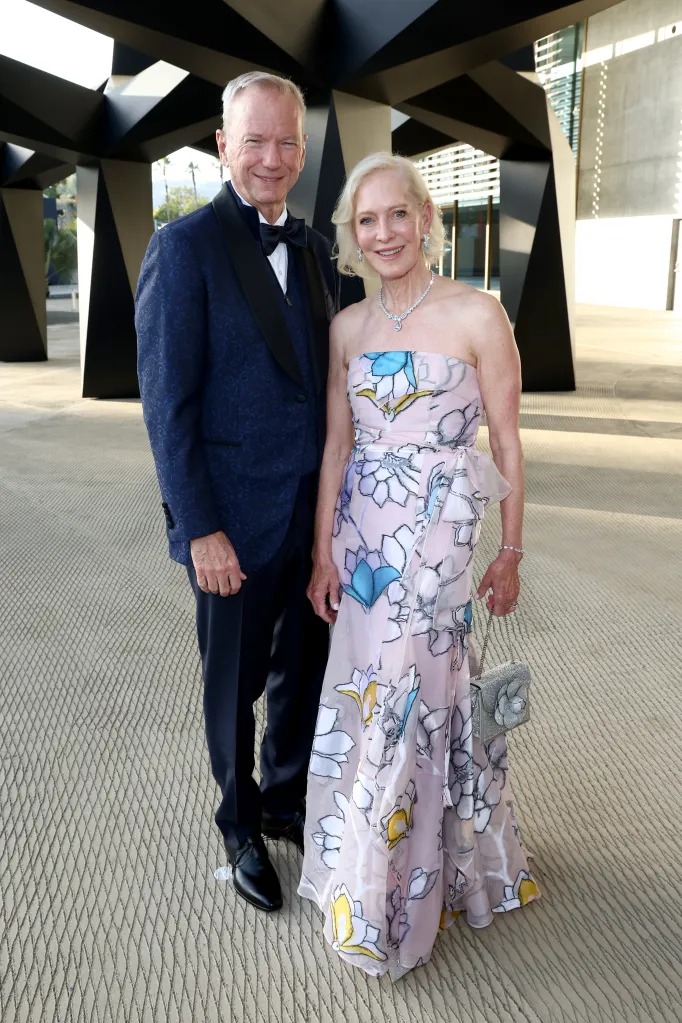 Eric Schmidt, in a black suit and black bow tie, and Wendy Schmidt, in a strapless pink floral gown.