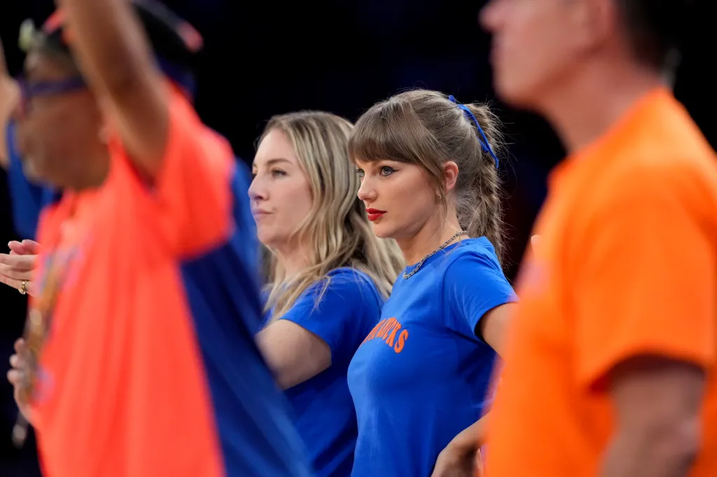 Este Haim and Taylor Swift watching Game 4 of the NBA Finals.