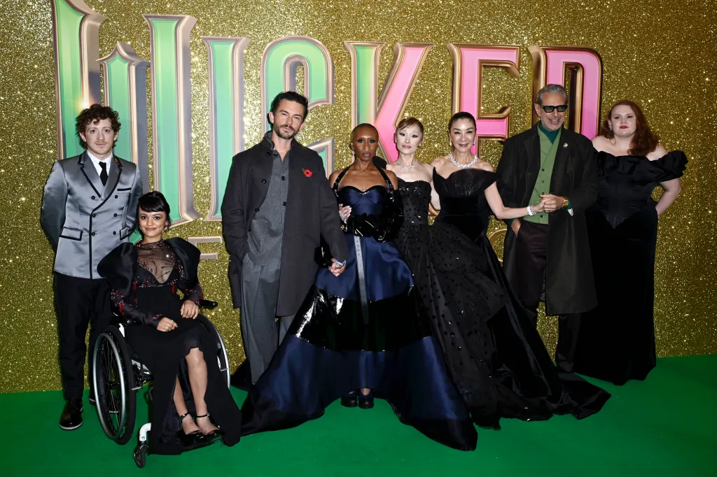 Ethan Slater, in a silver jacket, black pants, Marissa Bode, in a black gown,Jonathan Bailey, in a black coat and grey suit, Cynthia Erivo, in a black gown, Ariana Grande, in a black gown, Michelle Yeoh, in a black gown, Jeff Goldblum,in a black suit and green vest, and Bronwyn James, in a black gown, at the 
