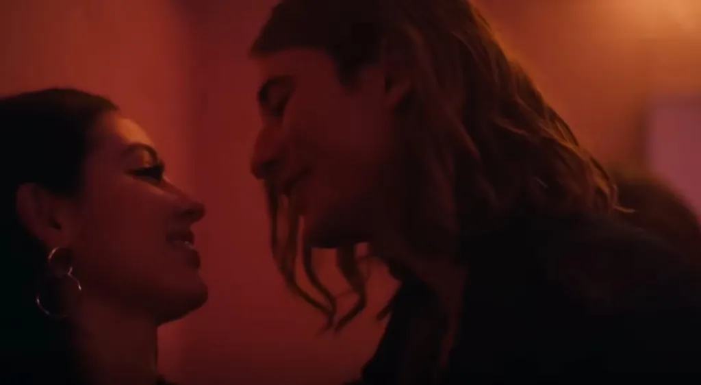 Maddy Perez and Tyler kissing in a club.