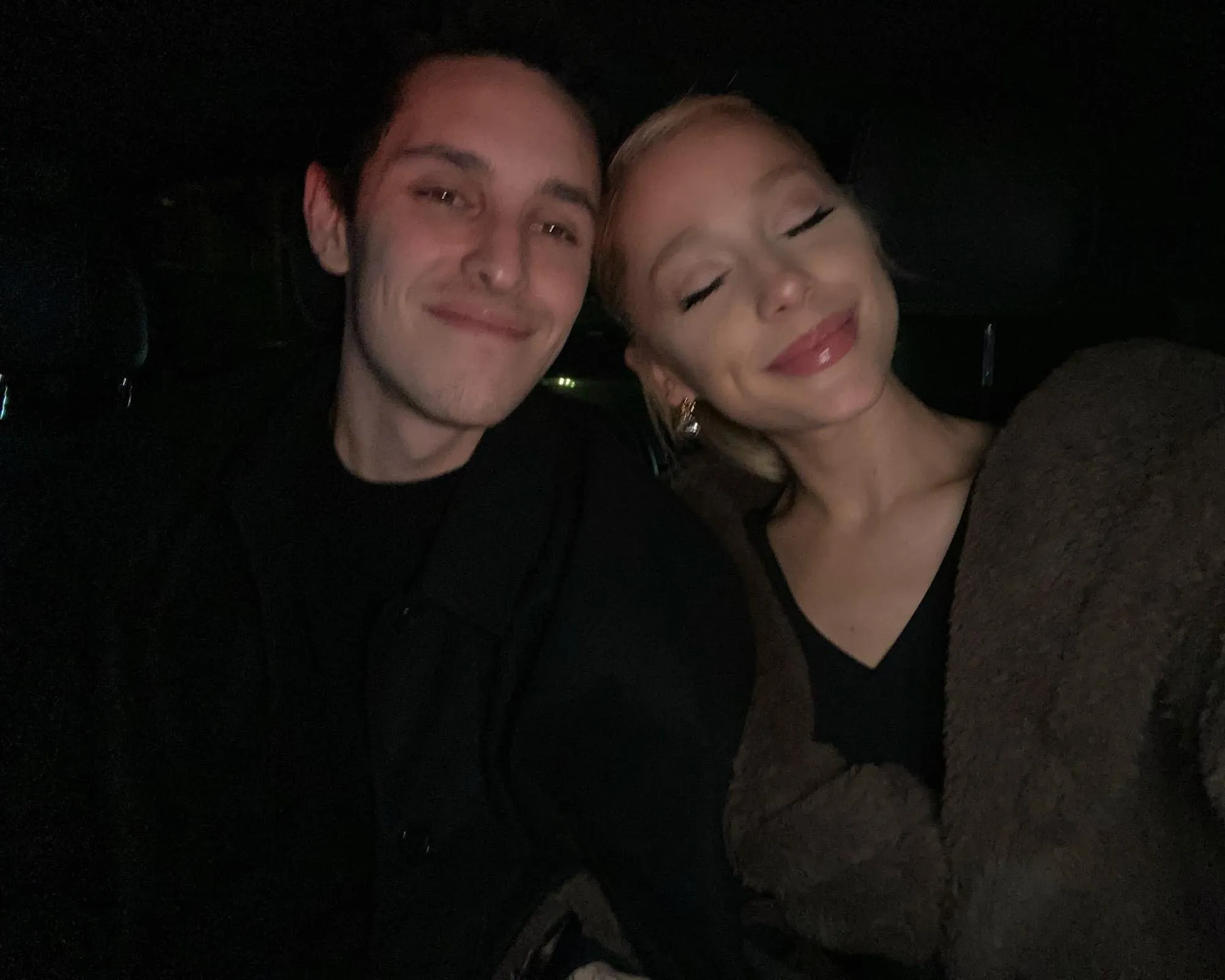 Ariana Grande and Dalton Gomez smiling together.