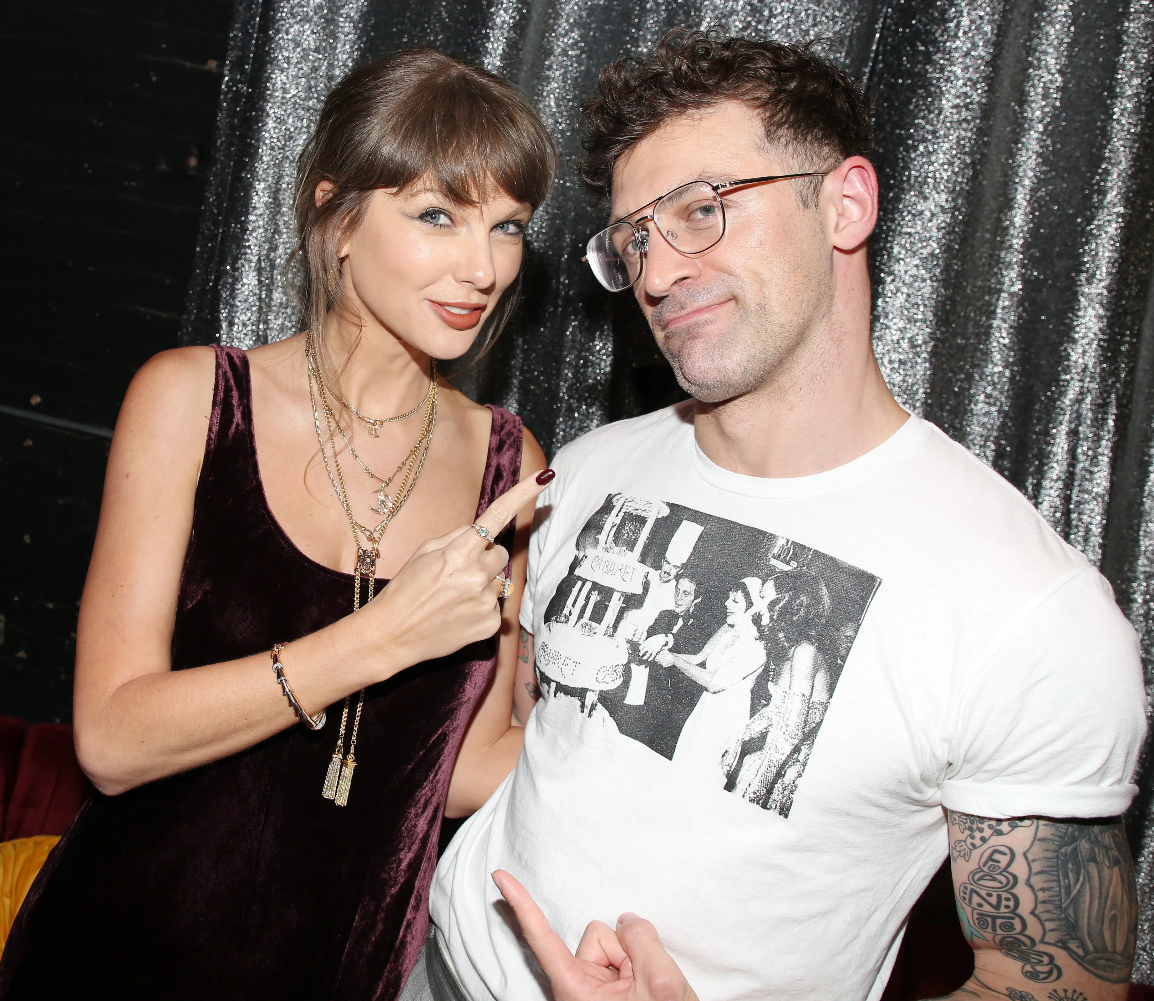 Taylor Swift and director Sam Pinkleton posing backstage.