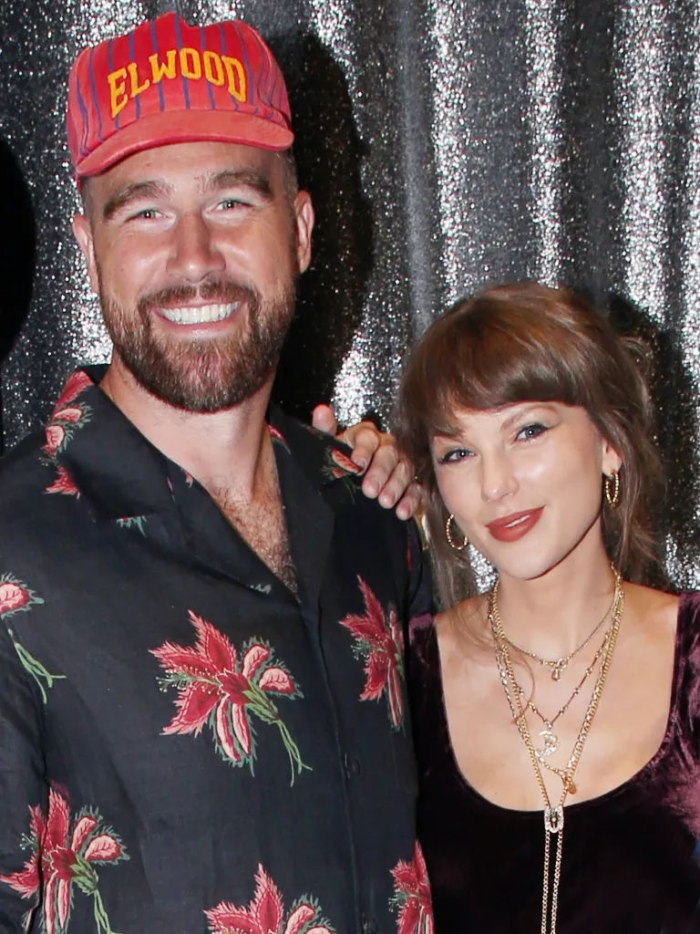 Travis Kelce and Taylor Swift posing backstage at the Broadway play 