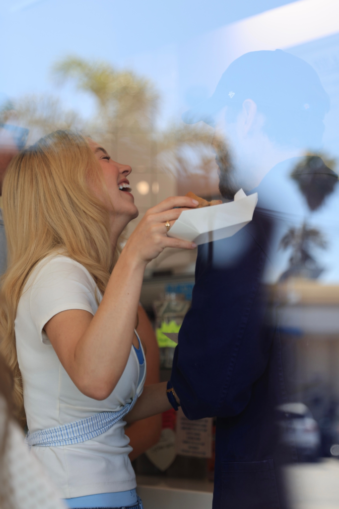 Sydney Sweeney and Scooter Braun share a kiss.