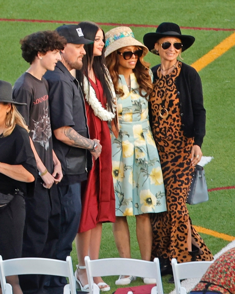 Kate Richie Madden, Nicole Richie, Joel Madden, Sparrow Madden, and Brenda Harvey-Richie pose for a family photo at a high school graduation.
